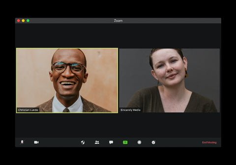 Two employees using Zoom features for meetings