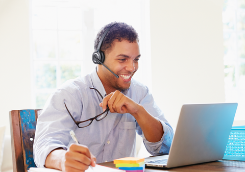 Best headsets for Microsoft Teams: man working on computer and wearing Leitner wireless headset