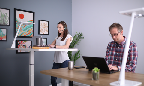 Office workers enjoying mobility with phone headsets