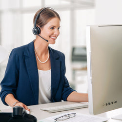 Businesswoman wearing Leitner wireless computer headset